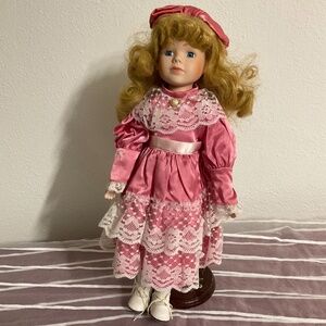 vintage porcelain doll 16 " tall with wood stand Collectors Collectible